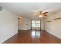 Bright and airy living room with hardwood floors and large windows, perfect for entertaining or relaxing at 14523 Lee Stewart Ln, Fishers, IN 46038