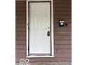 The front door of the house has a white door and a modern keypad entry system at 1521 N Tacoma Ave, Indianapolis, IN 46201