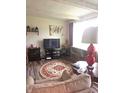 Cozy living room featuring nice flooring, warm lighting, and ample space for furniture and entertainment at 206 Allen Ln, Greenfield, IN 46140