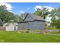 Spacious backyard featuring a barn and raised garden beds, perfect for outdoor living at 211 N County Line Rd, , IN 47272