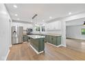 Modern kitchen with stainless steel appliances, granite countertops, and a central island at 3931 Tekesbury Ct, Plainfield, IN 46168