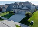 Stunning two-story home featuring a sprawling lawn, wide driveway, and an attached two-car garage at 4281 Viewforth Ln, Bargersville, IN 46106