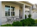 Inviting front porch with seating area, brick accents, and well-maintained landscaping, perfect for relaxing at 4281 Viewforth Ln, Bargersville, IN 46106