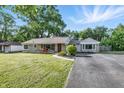 Single story home with well maintained lawn, stone facade, and asphalt driveway at 5170 Mt Pleasant N St, Greenwood, IN 46142