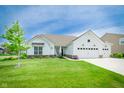 Beautiful single-Gathering home with well-maintained lawn, landscaping, and a three-car garage at 5294 Lndg Pl Ln, Noblesville, IN 46062