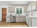 Bright kitchen featuring white cabinets, stainless steel appliances, and light wood flooring at 5982 Oak Hill East Dr, Plainfield, IN 46168