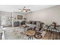 Cozy living room with comfortable seating, ceiling fan, and stylish decor creating a welcoming atmosphere at 7125 Chandler Dr, Indianapolis, IN 46217