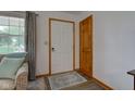 Bright foyer with hardwood floors and neutral walls leads into the rest of the home at 7911 Bentley Commons Dr, Indianapolis, IN 46259