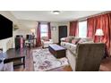 Comfortable living room with hardwood floors, plush seating, and lots of natural light at 8760 Big Bend Rd, Martinsville, IN 46151