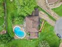 Aerial view of the home showcasing the roof and the in-ground pool in the backyard at 904 Dreamy St, Greenwood, IN 46142
