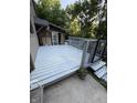 Inviting deck with gray stain and metal railing, perfect for outdoor relaxing and entertaining with an outdoor building at 9168 S State Road 9, Flat Rock, IN 47234