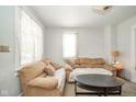 Cozy living room featuring comfortable sofas and natural light from the windows at 917 W 8Th St, Anderson, IN 46016