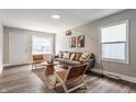 Open living room boasts with a modern style, decor, and plank flooring at 946 N Temple Ave, Indianapolis, IN 46201