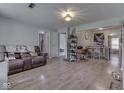 Open-concept living room with sleek floors and neutral wall color at 1603 S Morgantown Rd, Greenwood, IN 46143