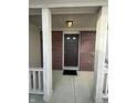 Covered front porch with brick accents, offering a welcoming entry to the home at 2734 Mingo Ct, Indianapolis, IN 46217