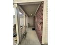 Covered front porch with brick accents, offering a welcoming entry to the home at 2734 Mingo Ct, Indianapolis, IN 46217