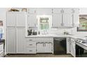 Close up of the kitchen sink and counters, featuring white cabinets and modern fixtures at 3090 N County Road 800 E Rd, Brownsburg, IN 46112