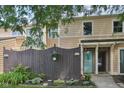 Charming townhome featuring a manicured front yard and a decorative wooden fence at 5152 Coppertree Ln, Avon, IN 46123