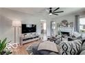 Bright living room with hardwood floors, fireplace and stylish furniture at 5363 Primrose Ave, Indianapolis, IN 46220