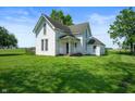 Charming two-story home with a covered porch and lush green lawn at 5396 N 1000 E, Sheridan, IN 46069
