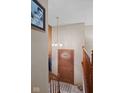 View of the home's entryway featuring a stained wood door with decorative glass and stairs leading upstairs at 618 Shady Creek Dr, Greenwood, IN 46142