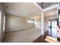 Spacious living room featuring neutral walls, plush carpeting, ample natural light, and decorative lighting fixtures at 6218 N Woodside Ct, McCordsville, IN 46055