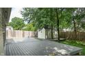 Spacious backyard deck and shed, perfect for outdoor entertaining and storage at 6816 Minnow Dr, Indianapolis, IN 46237