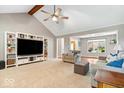 Spacious living room with vaulted ceiling, built-in shelving, and plenty of natural light at 770 Viewpoint Dr, Plainfield, IN 46168