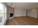 Bright living room featuring a fireplace with stone surround at 10424 Oak Bend Blvd, Indianapolis, IN 46239