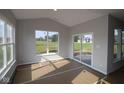 Cozy sunroom with bright windows and a sliding glass door at 10424 Oak Bend Blvd, Indianapolis, IN 46239