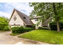 Charming two-story home with a well-maintained lawn and mature trees providing shade and curb appeal at 11544 Crestwood Ct, Indianapolis, IN 46239