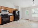 Well-equipped kitchen features essential appliances and ample cabinet space, complemented by bright natural light at 12121 Driftstone Dr, Fishers, IN 46037