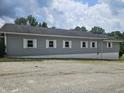 Light gray building with gray and white trim, with several regularly-spaced windows visible at 1267 W 750 S, Trafalgar, IN 46181