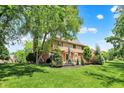 Expansive backyard featuring lush greenery, mature trees, and a patio area perfect for outdoor entertaining at 1377 Sedona Dr, Carmel, IN 46032