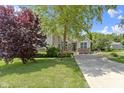 Beautiful home with lush green lawn, mature tree, and a welcoming entrance at 15098 Newburyport Dr, Fortville, IN 46040