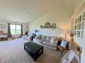 Bright and airy living room featuring vaulted ceilings, neutral decor, and ample space for relaxation and entertainment at 1980 Bridlewood Dr, Franklin, IN 46131