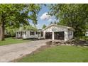 Exterior angle of home, featuring two car garage, large yard, and neutral siding color at 20797 Roberts Dr, Sheridan, IN 46069