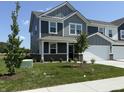 Beautiful two-story home with a well-manicured lawn, featuring mature trees and professional landscaping at 2954 Grand Rdg Dr, Greenwood, IN 46143