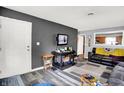 Living room featuring vinyl floors, neutral walls, and ample natural light at 3038 S Richardt Ave, Indianapolis, IN 46239