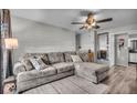 Comfortable living room with a plush sectional sofa and modern ceiling fan at 5201 Gringo Dr, Indianapolis, IN 46237