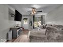 Living room featuring wood flooring, stylish furnishings and abundant natural light at 5201 Gringo Dr, Indianapolis, IN 46237