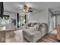Inviting living room featuring wood flooring and a comfortable sectional sofa at 5201 Gringo Dr, Indianapolis, IN 46237