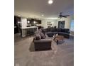 Spacious living room open to kitchen with large sectional and eat in kitchen at 610 Sawtooth St, Westfield, IN 46074