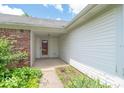 The front porch is brick and siding with a storm door at 626 Tulip Poplar Ct, Mooresville, IN 46158