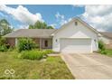 Charming single-story home with a two-car garage and well-manicured lawn and landscaping at 626 Tulip Poplar Ct, Mooresville, IN 46158