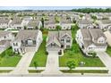 Stunning aerial view showcasing the home's location within a well-planned community with lush green spaces at 6670 Shooting Star Dr, Whitestown, IN 46075