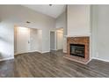 Bright living room with vaulted ceilings, fireplace, and neutral paint at 6740 Sundown S Dr, Indianapolis, IN 46254