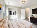 Cozy bedroom featuring neutral colors, a closet, and a comfortable bed with soft pillows at 6933 Sonora Blvd, Clermont, IN 46234