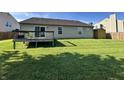 Spacious backyard with a wooden deck, perfect for outdoor entertaining and relaxation at 1202 Tomahawk Pl, Martinsville, IN 46151