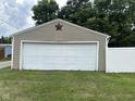 Detached garage with a white garage door and exterior star decoration at 1395 Evans Ave, Noblesville, IN 46060